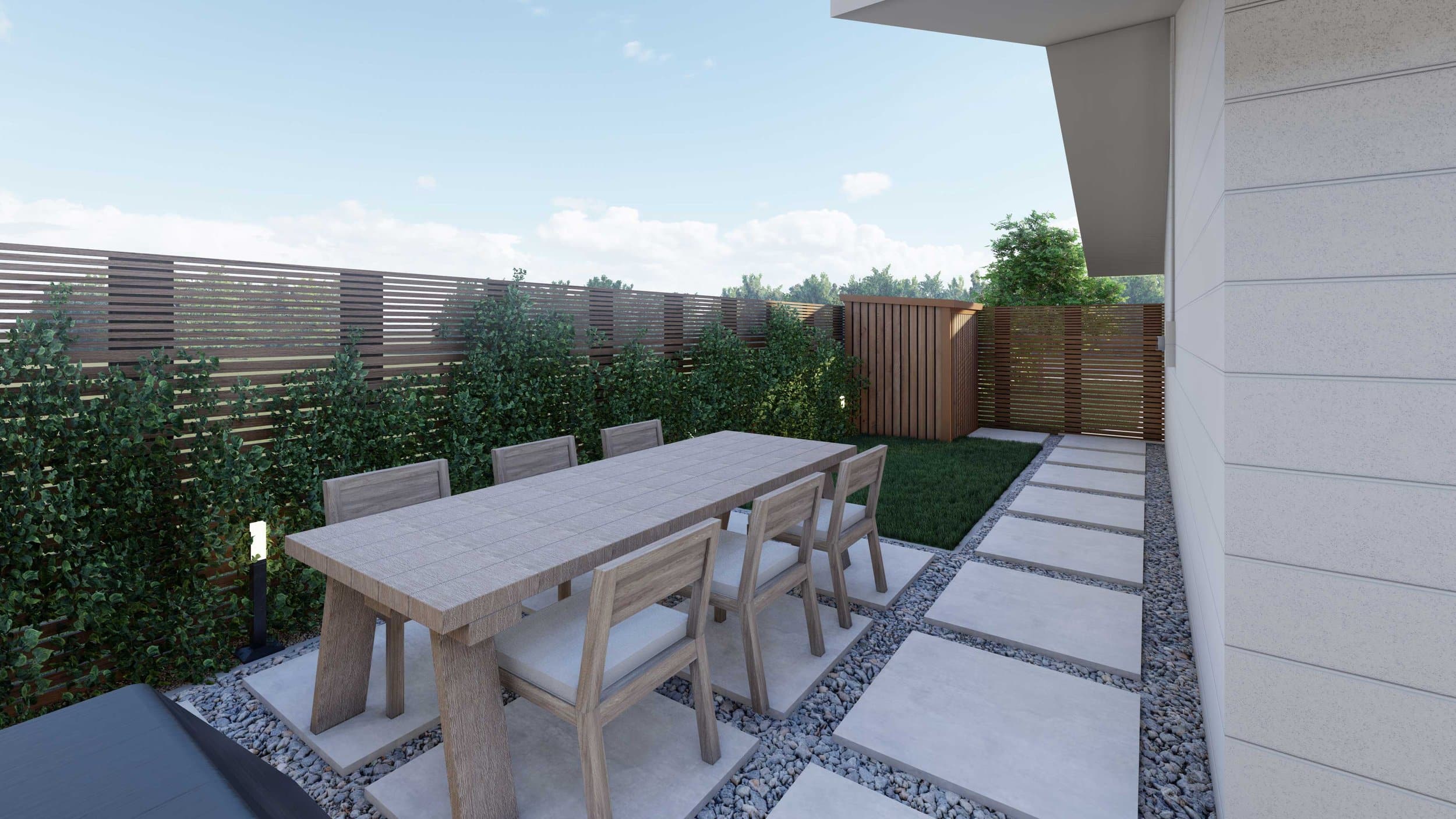 small backyard with planters alongside fence and outdoor dining set on concrete paver and gravel patio