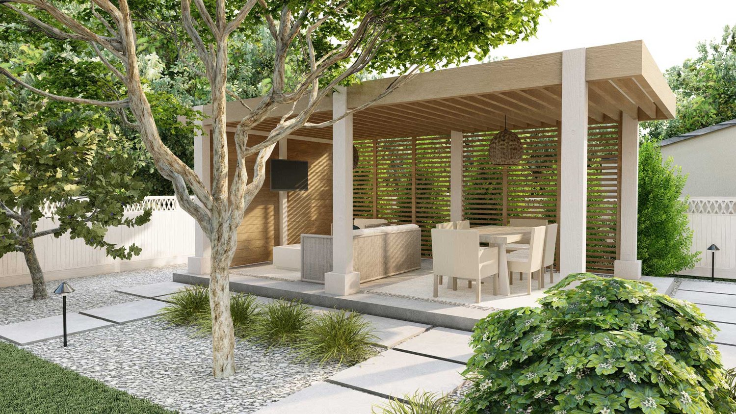 Thousand Oaks courtyard showing tree in gravel in front of a deck patio with pergola over dining and lounging area