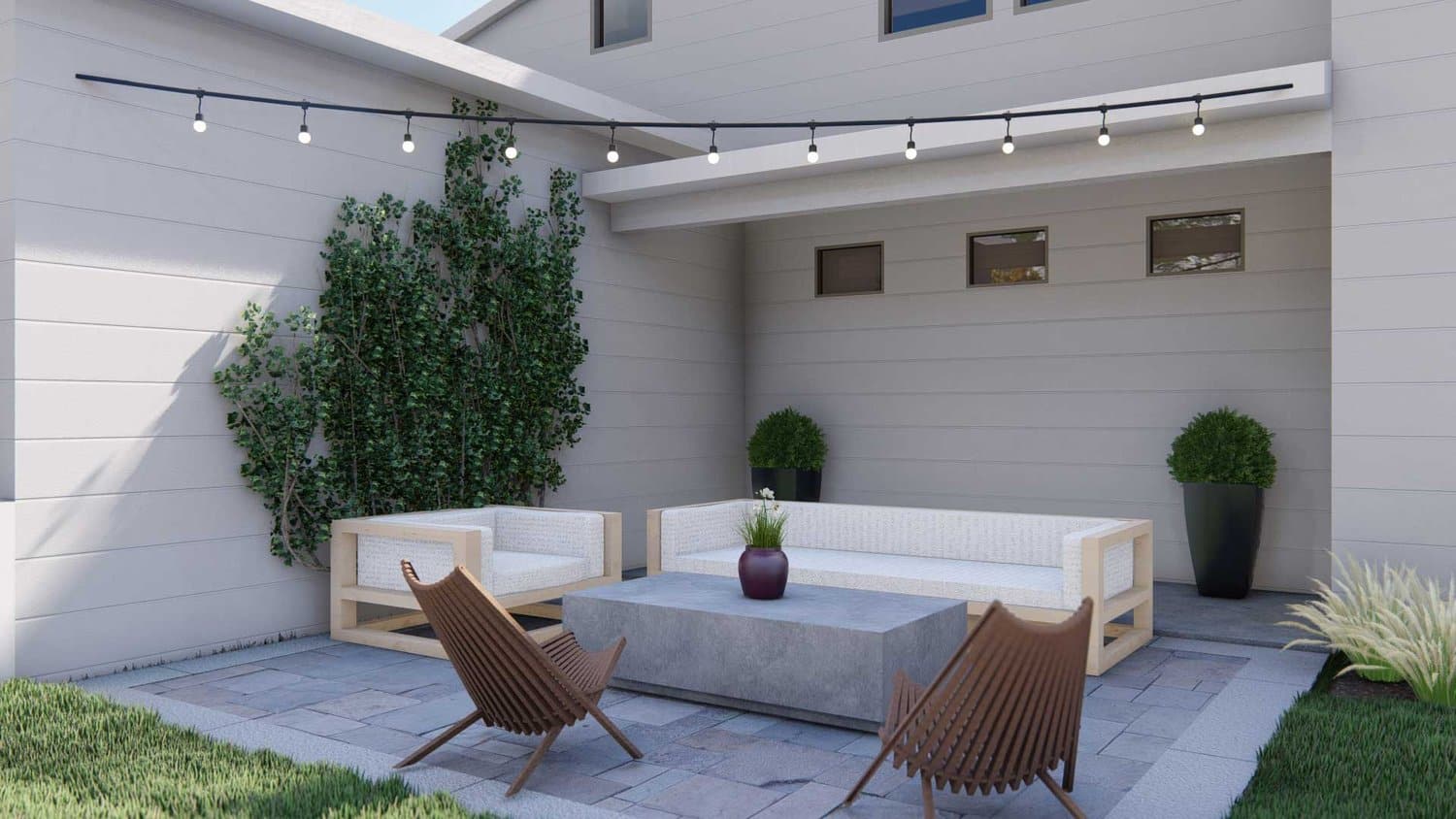 Twin Falls backyard showing string lights over concrete paver patio seating area with plants
