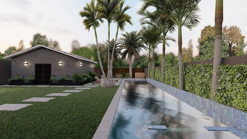 long bckyard with custom pool, palm trees around perimeter, and paver path