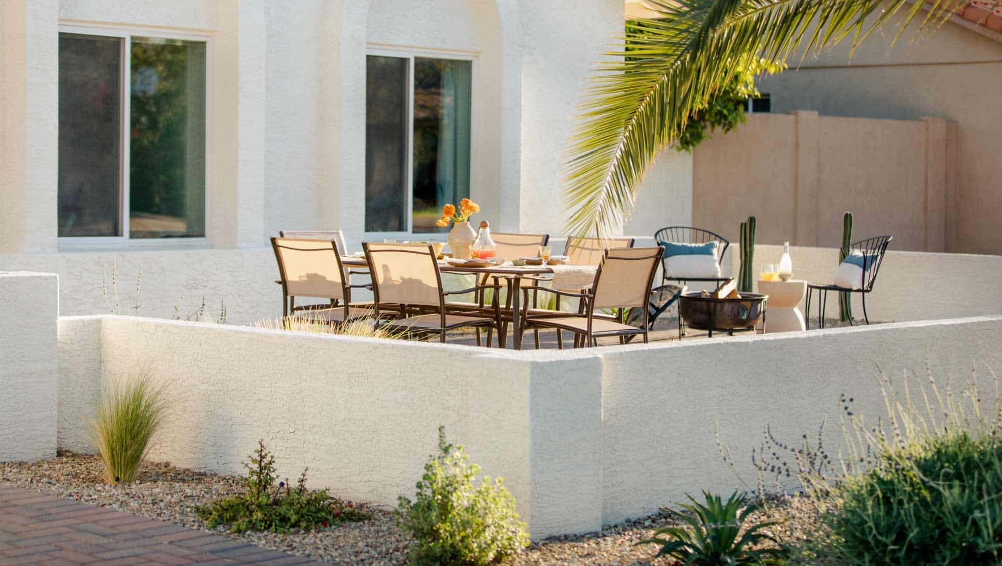 Close up of walled front yard patio with outdoor dining area