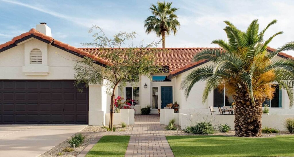 Southwestern style home with walled front yard patio