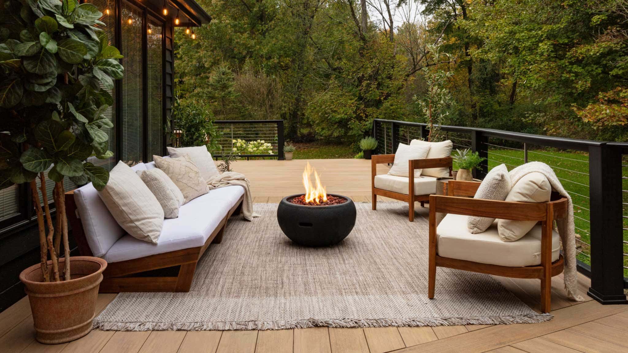 Stylish backyard deck with lounge seating and fire pit