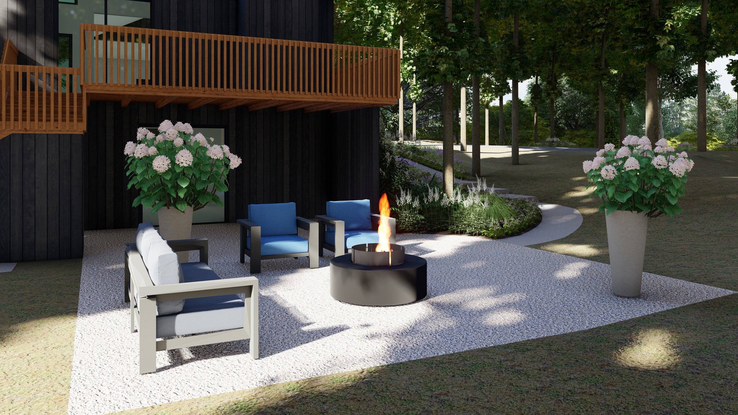 Gravel backyard seating area with round black metal fire pit, outdoor sofa, two lounge chairs, and hydrangeas in containers.