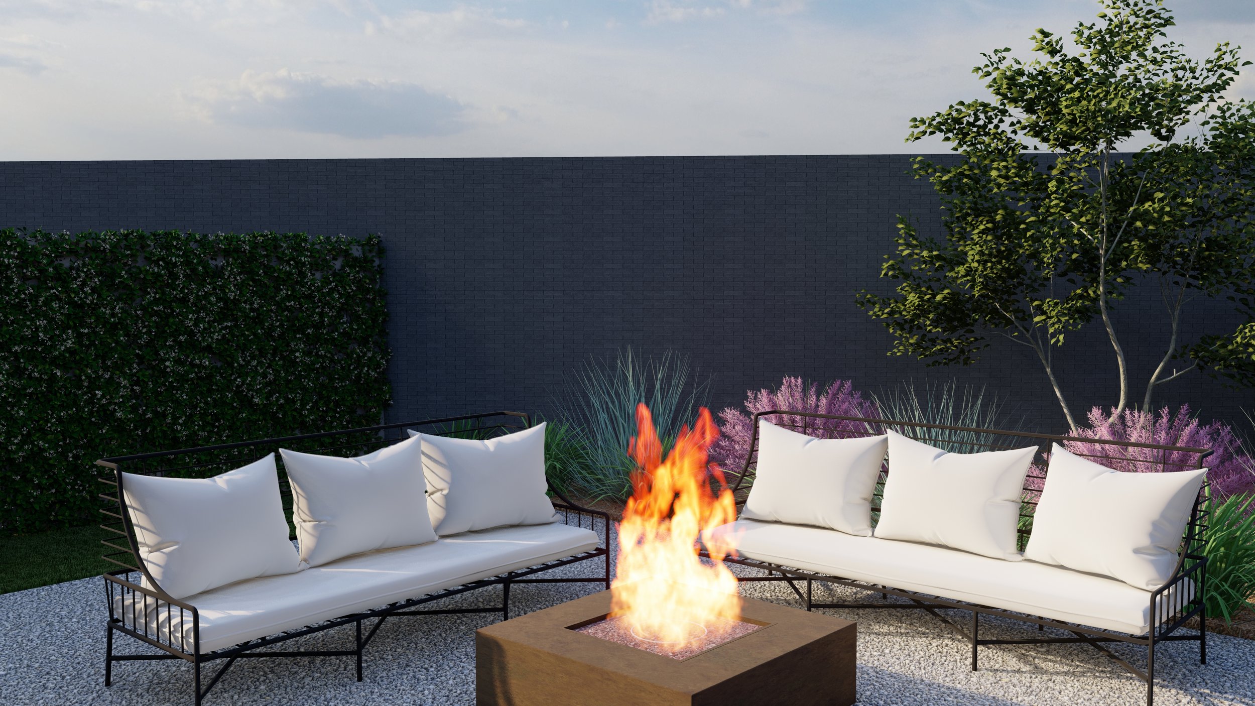Two black metal outdoor sofas around a square fire pit on gravel patio.