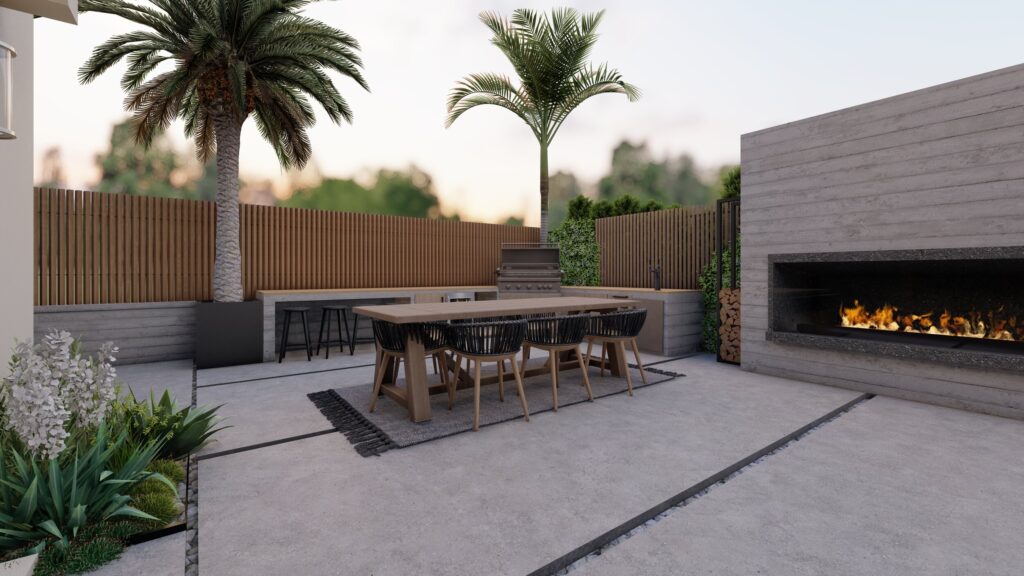 Large outdoor fireplace as the focal point of a backyard bbq and dining area