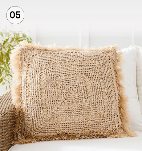 Faux natural fiber crochet fringe throw pillow.
