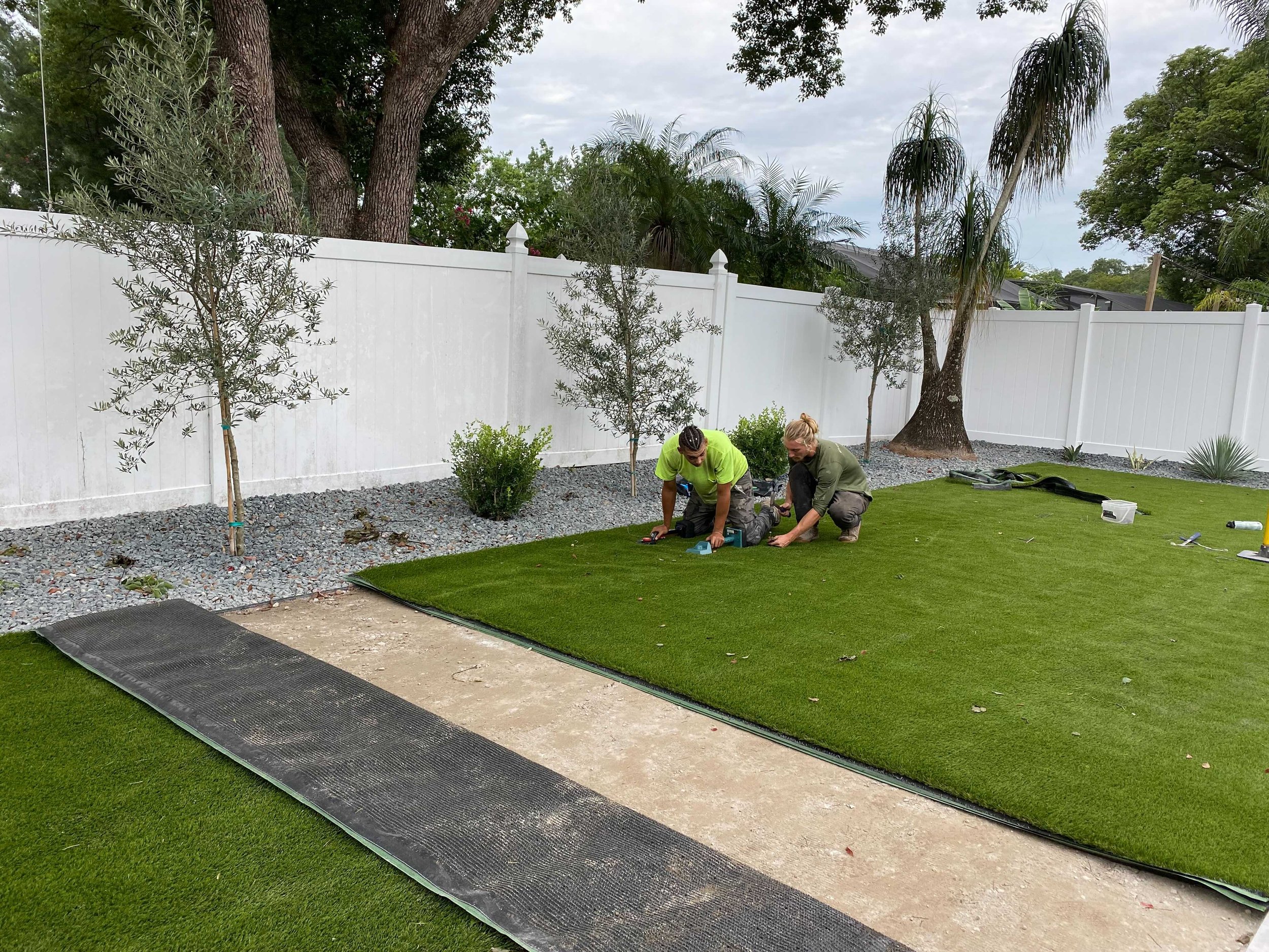 Yardzen Pro contractor installing artificial grass for a Yardzen project in Winter Park, Florida