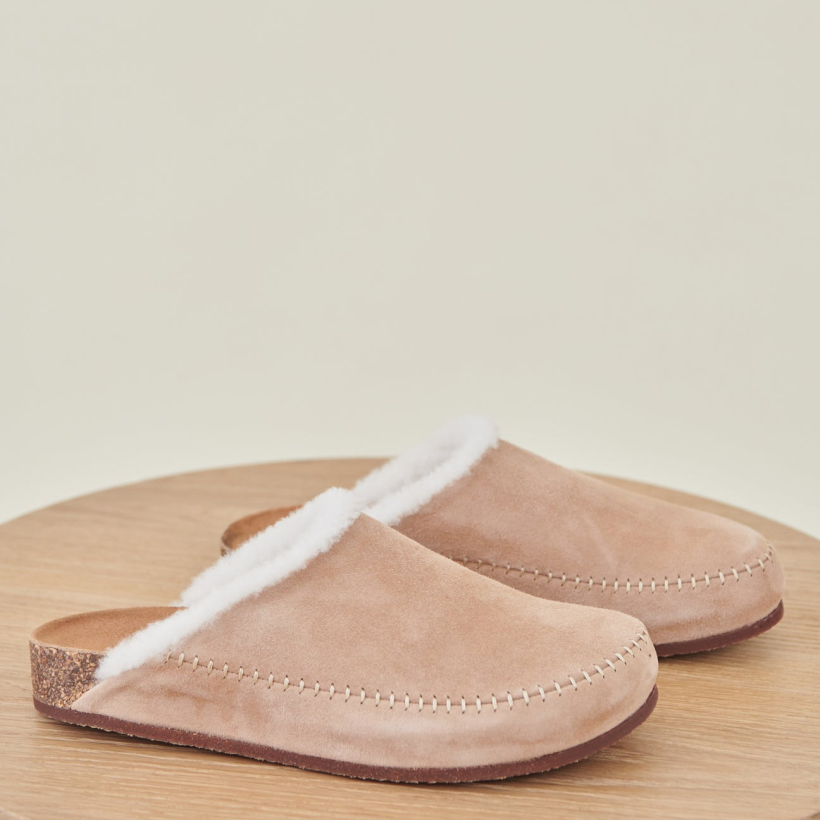 10 Shearling-Lined Moc Clogs - Jenni Kayne’s go-anywhere slippers are made from suede and a warm shearling lining. So, whether you’re sipping morning coffee on the porch or enjoying a casual alfresco meal, we’re betting you’ll live in these soft mocs all season. SHOP NOW >” loading=”lazy”></noscript><br/><img loading=