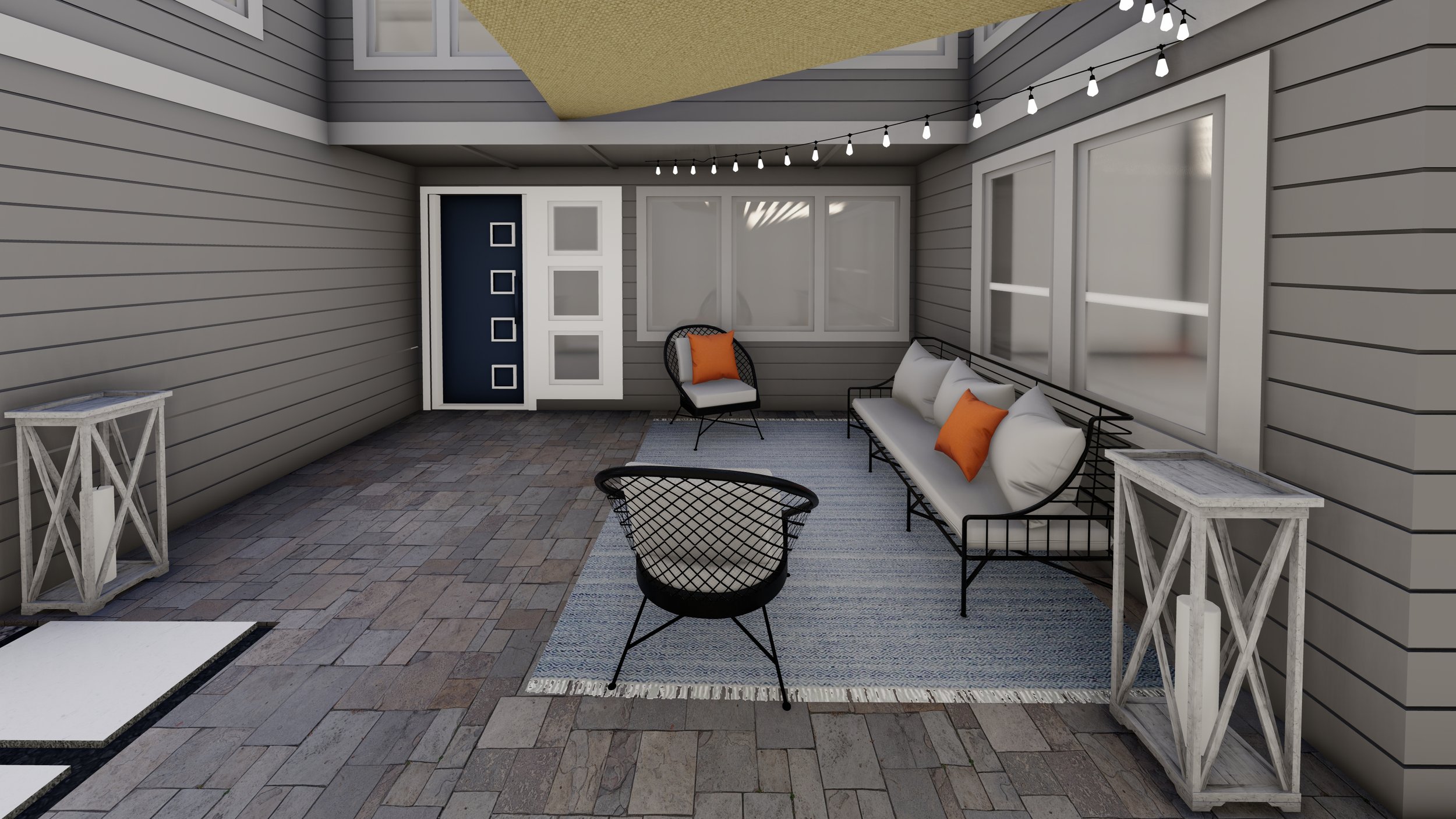Paved courtyard and residential entrance with balck metal outdoor sofa and lounge chairs.