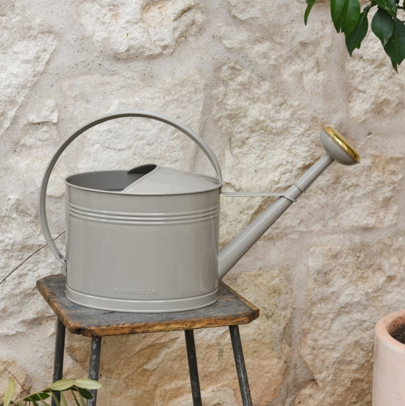 06                        Enamel Watering Can - A stylish watering can is one easy way to add a seasonal flair to your porch. We love the warm neutrals of this beauty from Magnolia.SHOP NOW >
