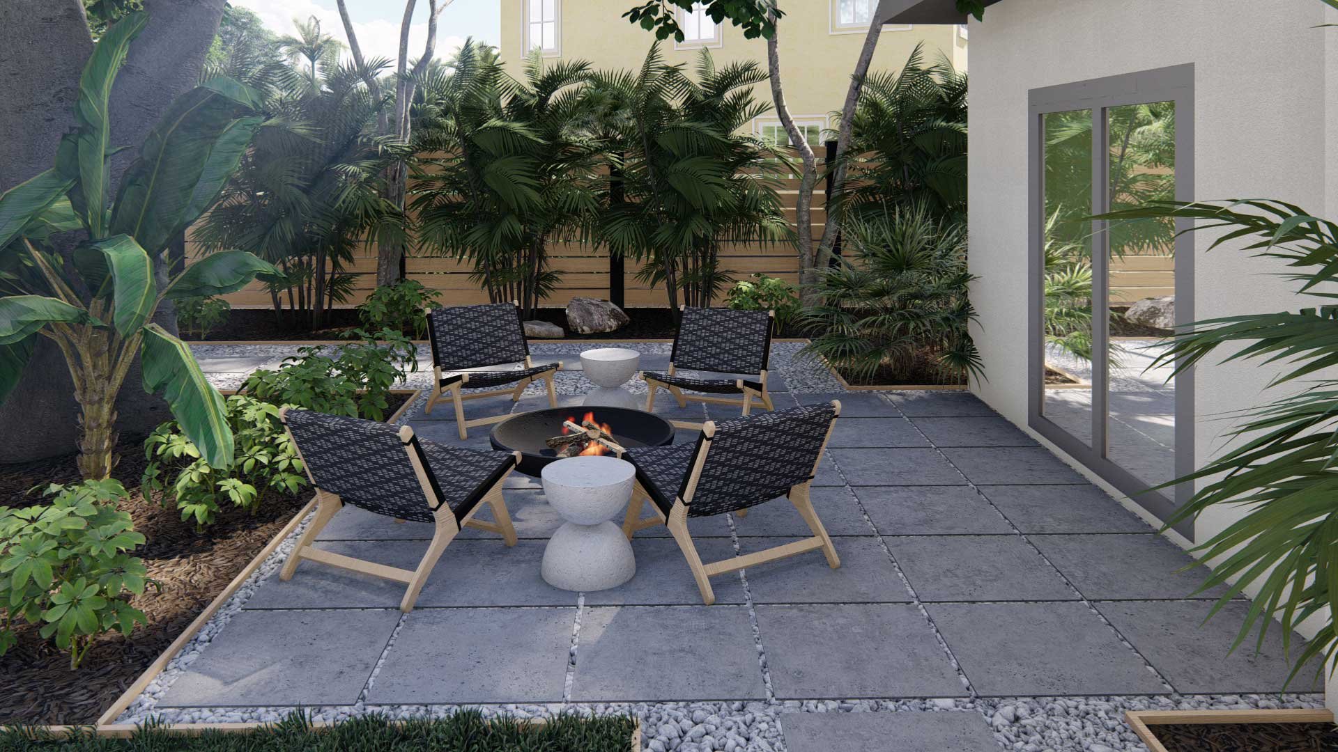 Side yard outdoor lounge area with fire pit on top of gravel and pavers