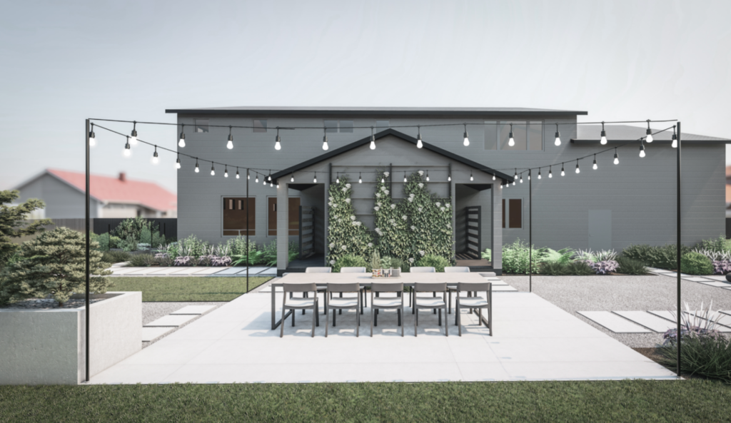 Gray home exterior with outdoor dining area with string lights above
