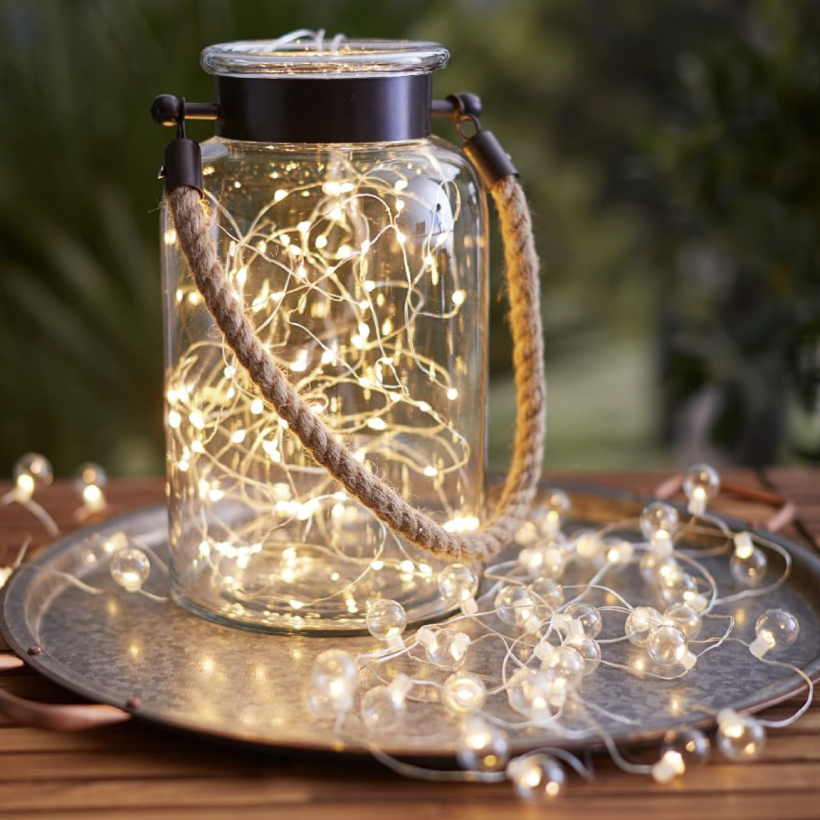 07                                   Mini LED String Lights - Add a festive ambiance to your outdoor gathering spaces by wrapping tree trunks and branches in Pottery Barn’s flexible mini LED string lights. Battery powered; these sparkly lights make it easy to add outdoor lighting and brighten up every corner of your yard. They’re also eco-friendly, and last up to 80 hours on a single AAA battery charge. SHOP NOW >” loading=”lazy”></noscript><br />
<img decoding=
