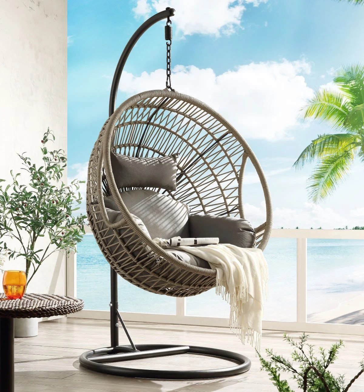 round rattan hanging chair with stand and grey cushions
