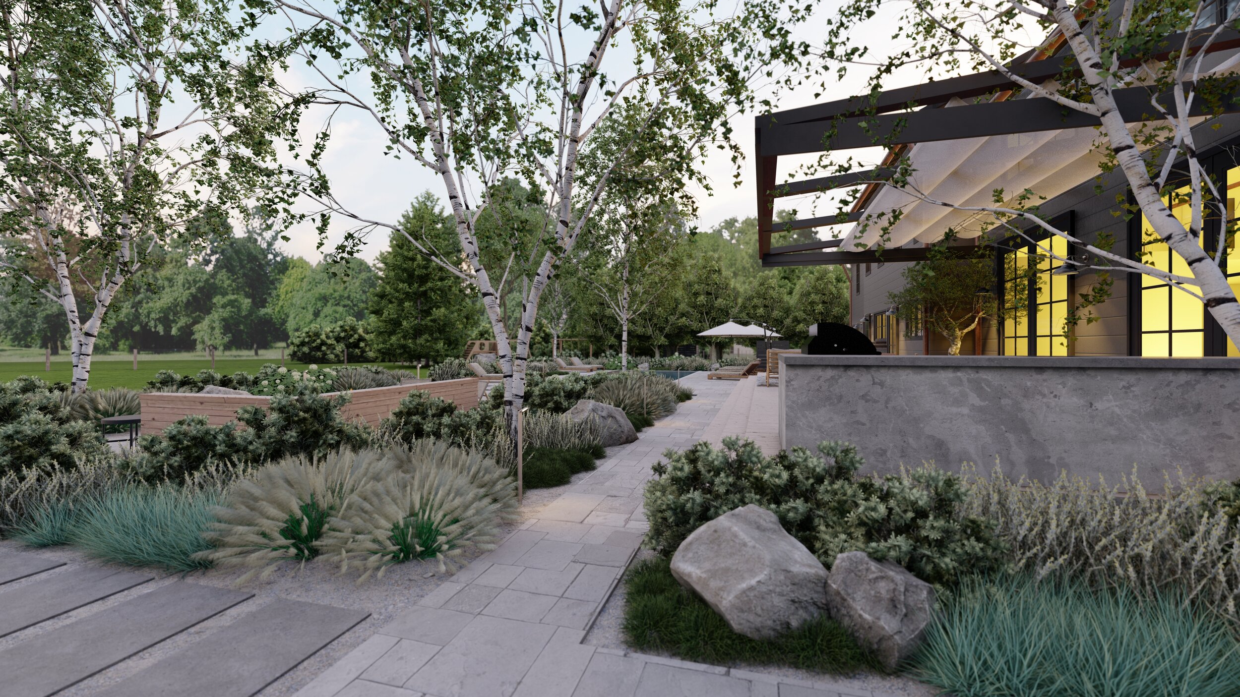 View from side yard of dark charcoal home exterior with grasses, birch trees near outdoor dining area and outdoor kitchen under pergola