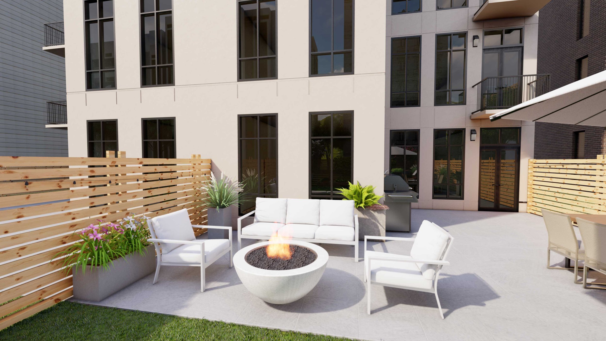 Side outdoor sitting area, with fire pit, plant pots and artificial grass.