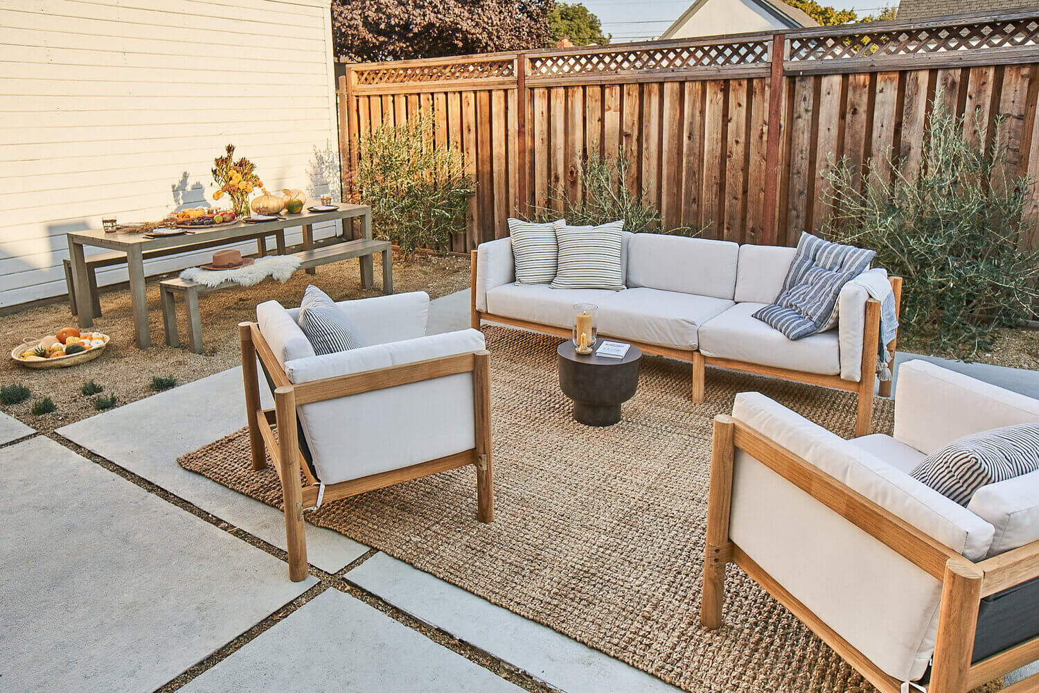 Two Neighbor chairs and sofa on a patio in San Leandro backyard.