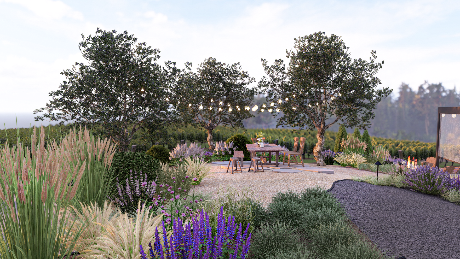 Expansive view of vineyard with chairs around an outdoor dining table on gravel with lush plantings around