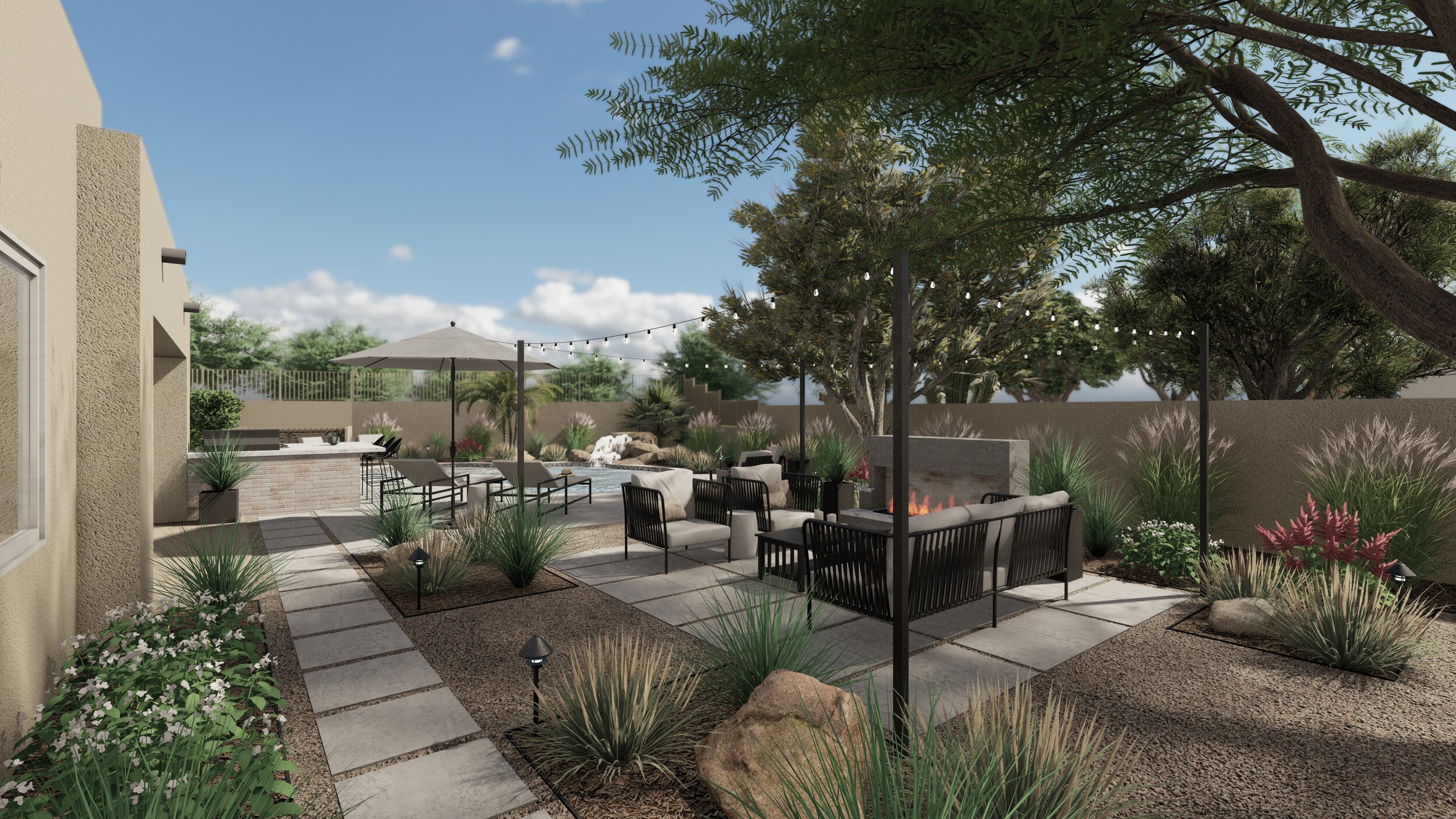 View of desert inspired backyard with swimming pool near outdoor kitchen, lounge area, and fire pit with string lights