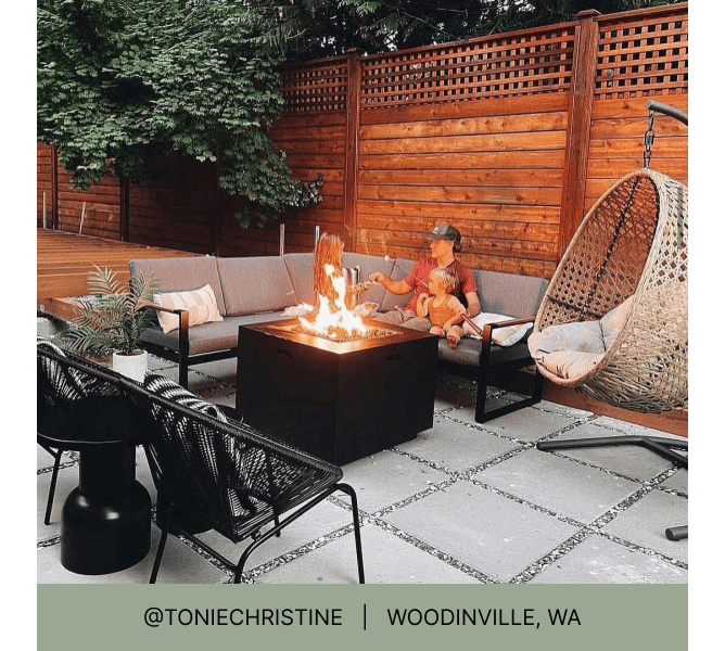 Man and toddler on outdoor sectional on paved fire pit seating area and heading that reads @toniechristine Woodinville, WA