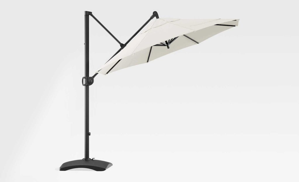 The Round Sunbrella Cantilever umbrella by Crate and Barrel with a black frame and white canopy