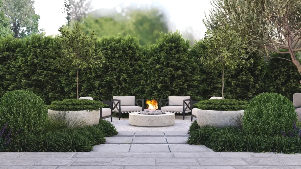 Mediterranean inspired backyard landscape design for fire pit area with evergreen trees creating privacy behind and low growing grasses and tall shrubs creating visual interest in the foreground