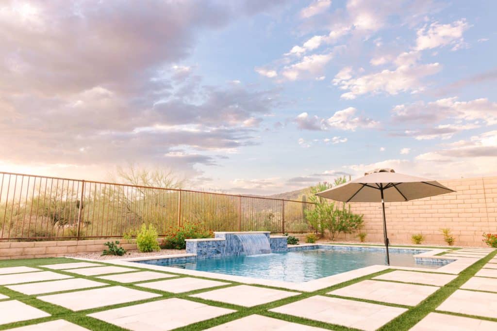 An expansive patio in a Tucson backyard designed by Yardzen