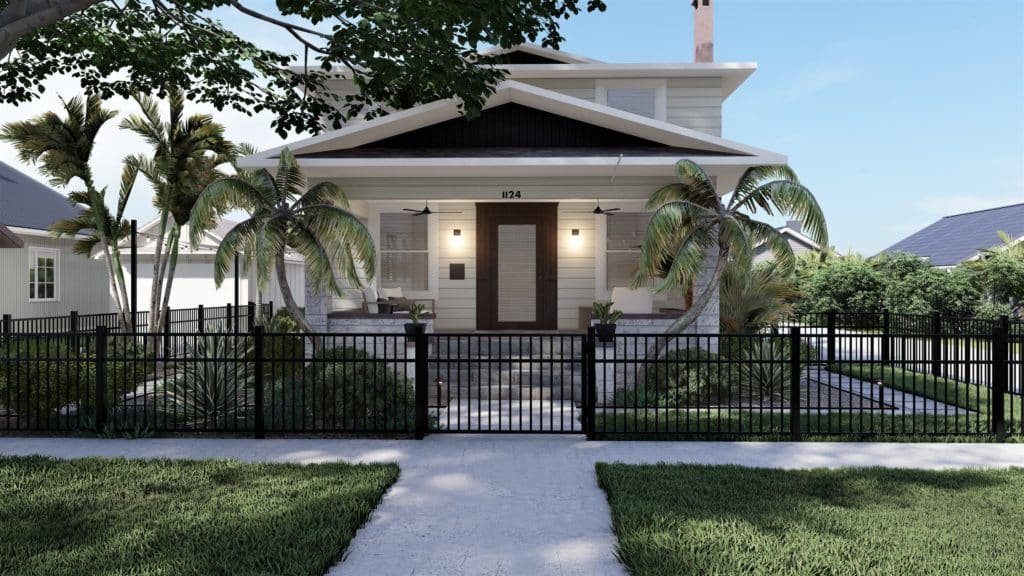 White bungalow style home with tropical plantings in front yard and vertical post metal fence