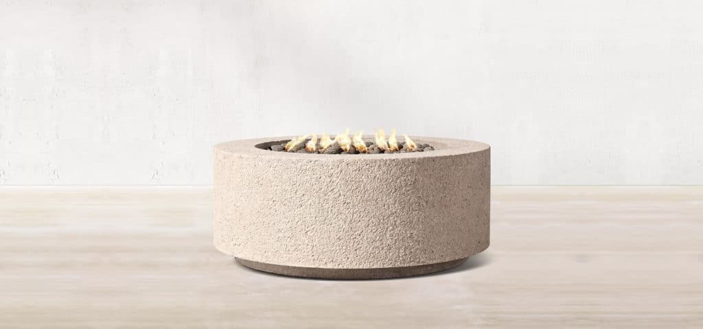 Round concrete composite fire pit with weathered, natural-colored finish