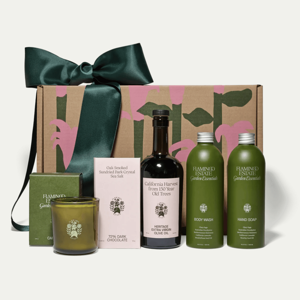 Gift set with bottles of olive oil, soap, and candle