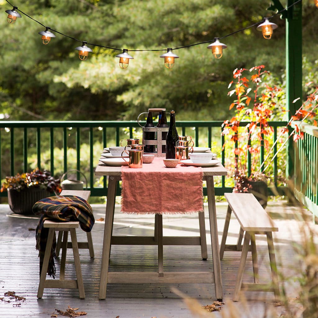 Fall scene with outdoor dining table on porch