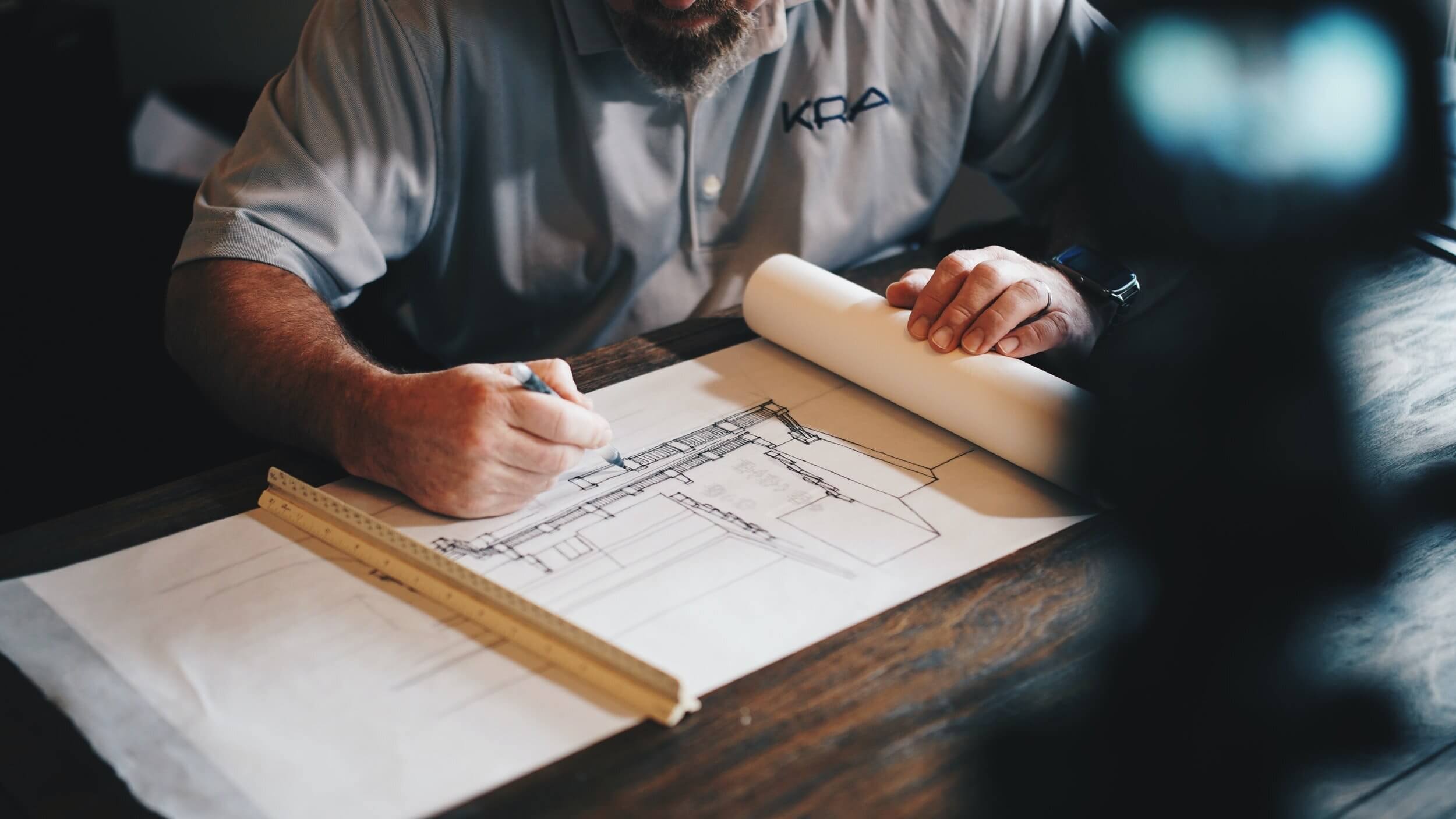 a person reviewing an architectural rendering.