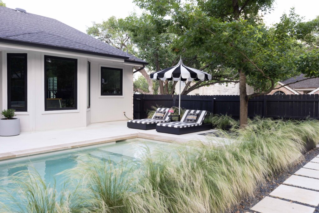 Austin plunge pool with wild grasses and corten steel edging