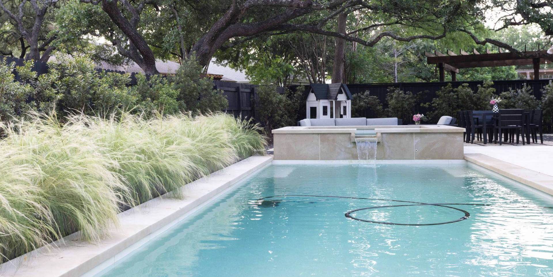 Ornamental grass near plunge pool with hot tub