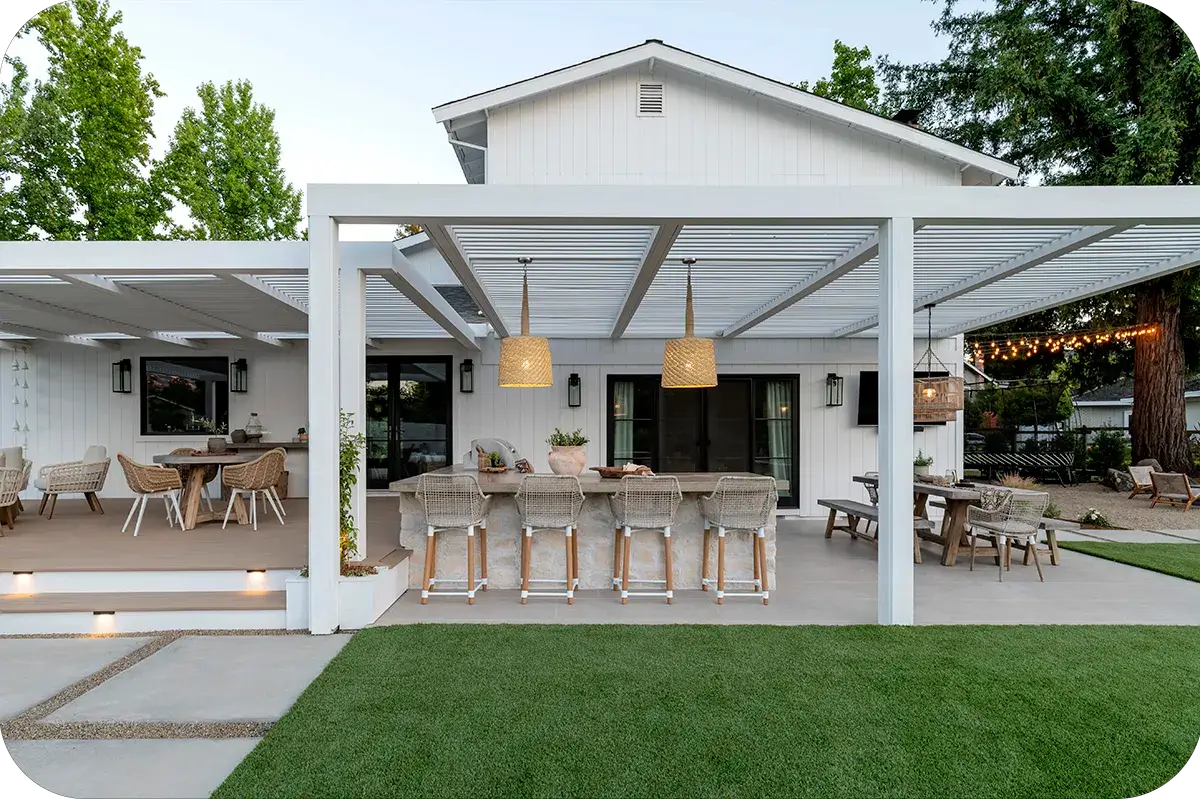 backyard with a patio, pergola, and outdoor kitchen