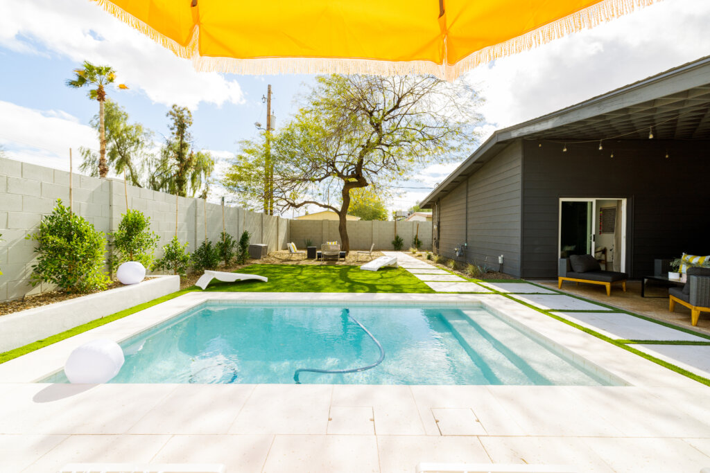 Backyard with plunge pool near outdoor seating area
