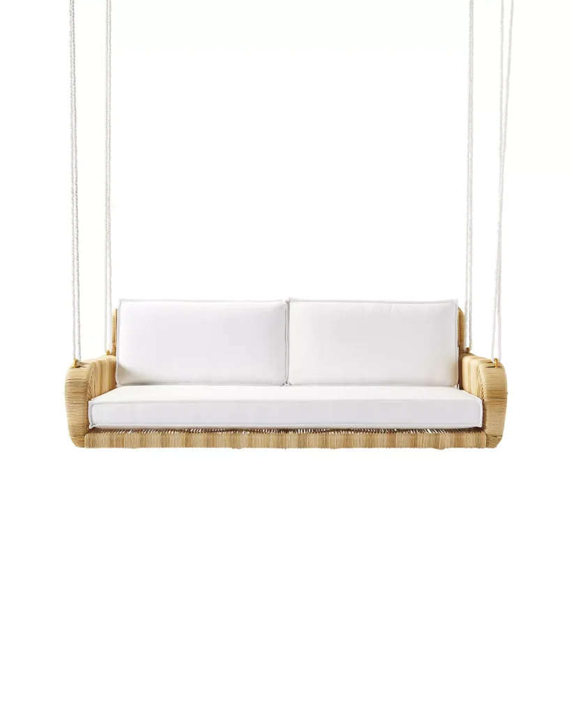 Wicker hanging chair with white cushions