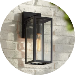 Exterior of House metal wall light mounted on a white brick house.