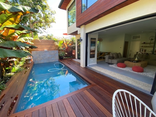 Tropical backyard with small plunge pool near living room