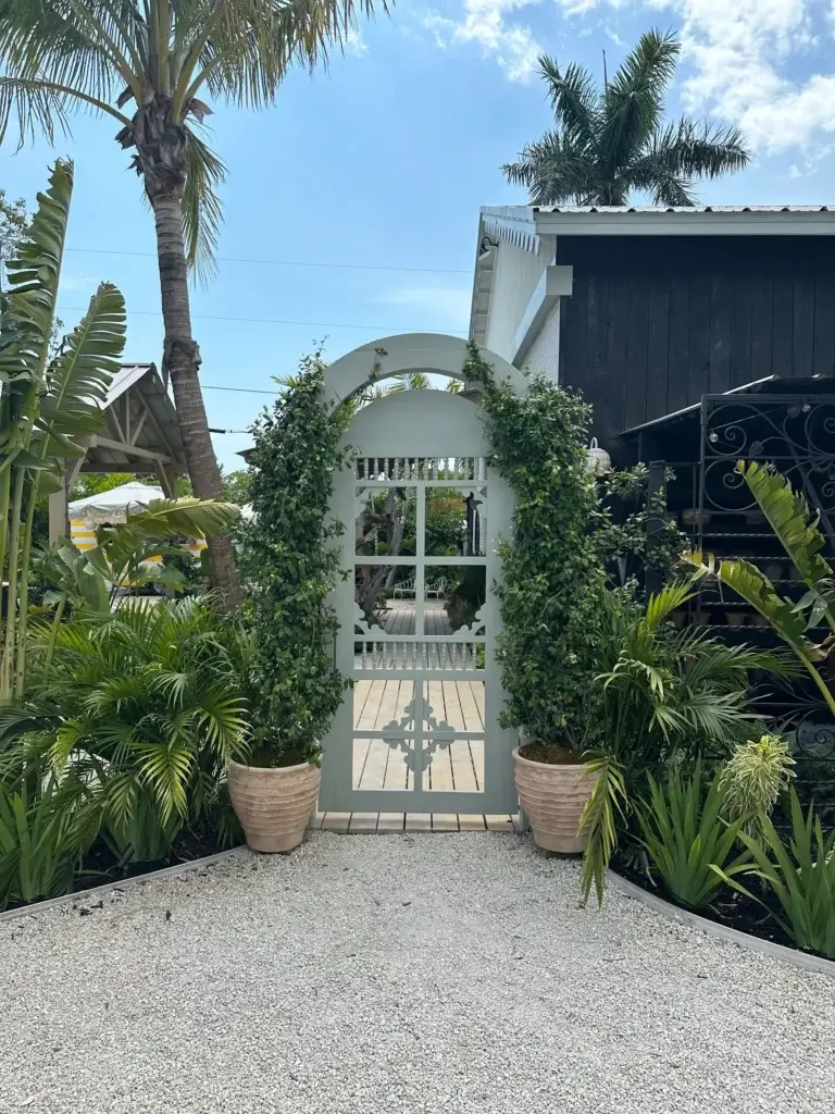 Tropical plants and vines add privacy to the entrance of The Fox Mercantile