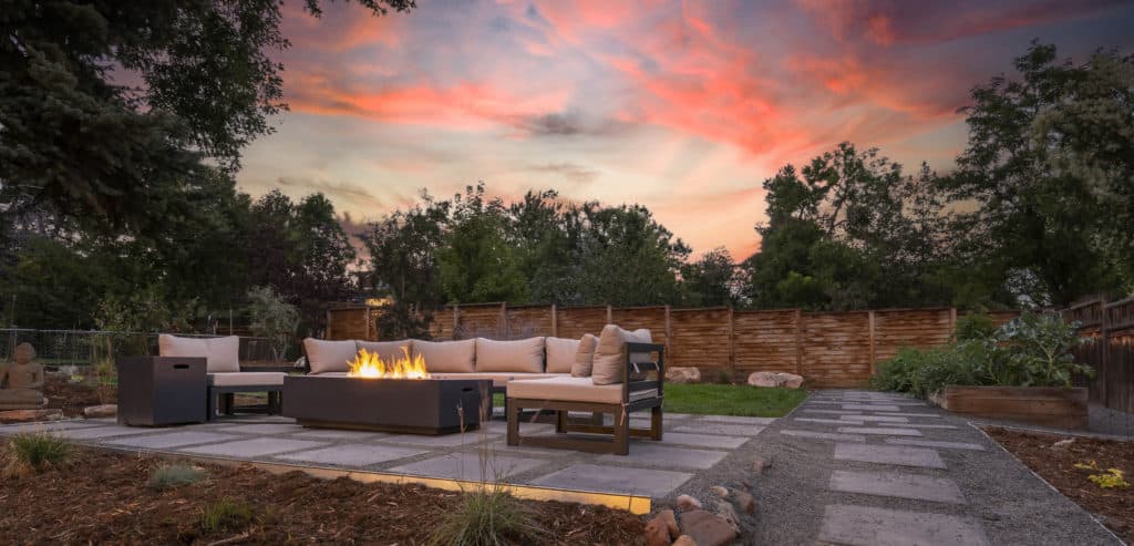 Backyard with fire pit and beautiful sunset