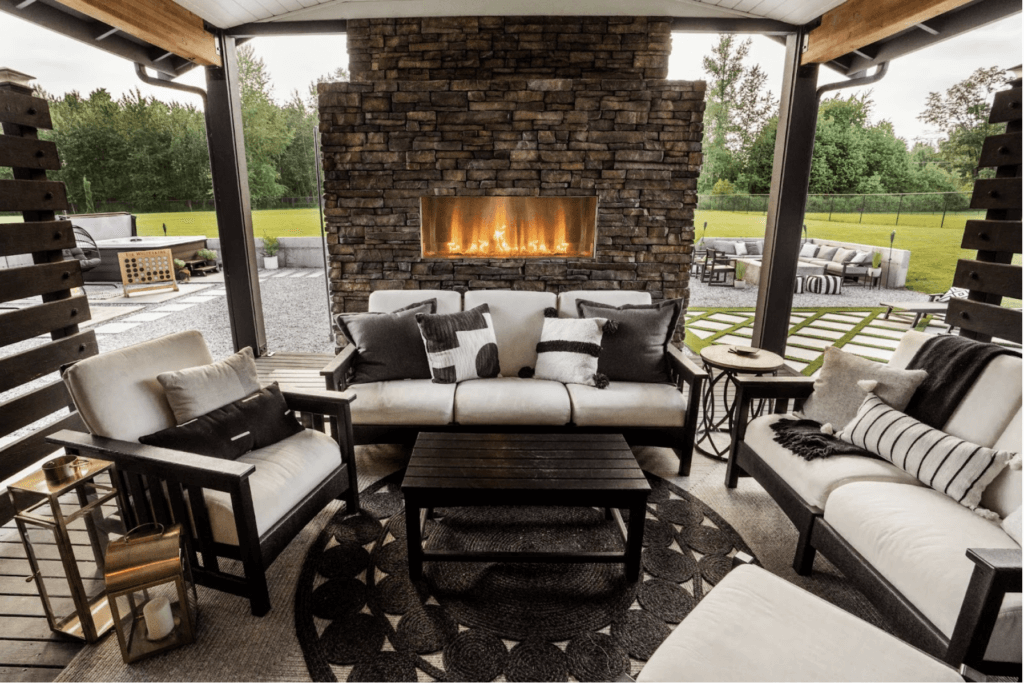 luxury covered patio with a roaring fireplace