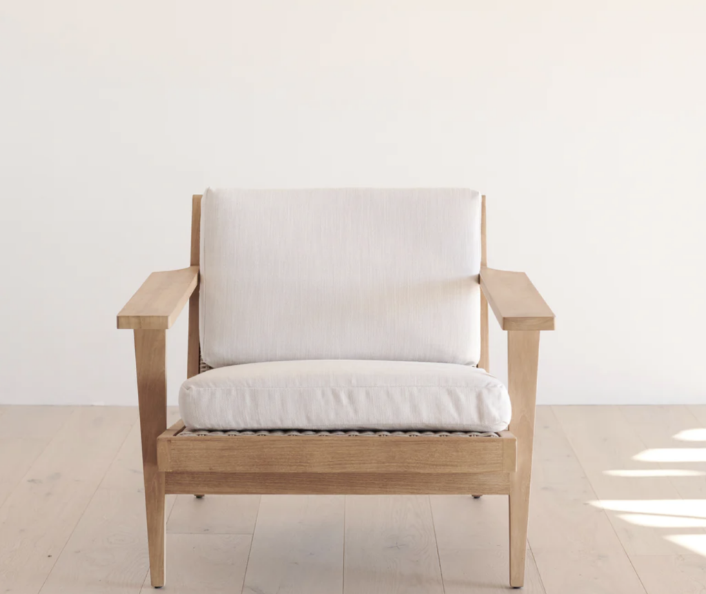 Wood framed chair with white cushion