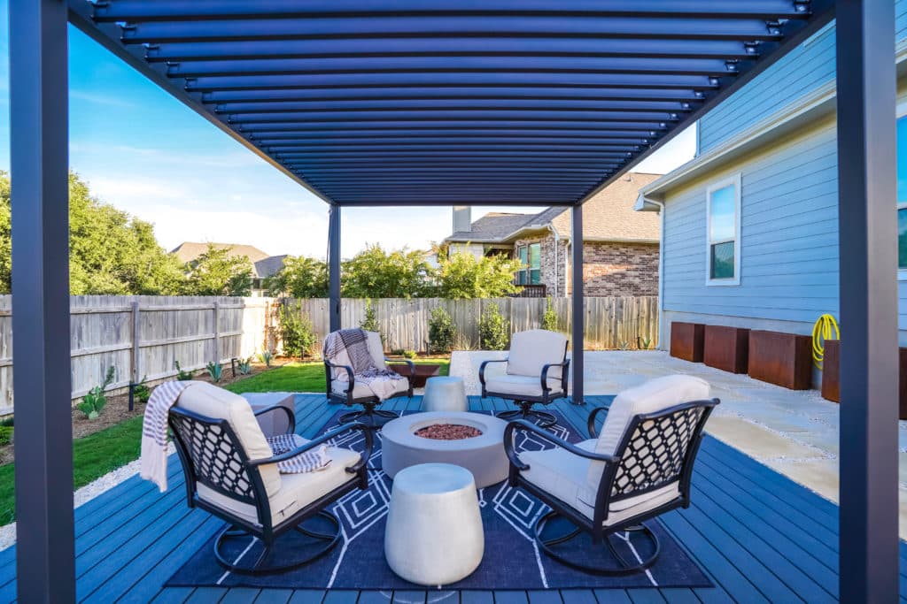 Metal levered pergola shading a modern fire pit seating area