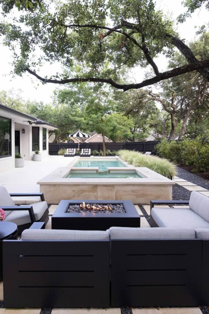 A contemporary design- a view from the fire pit looking over the pool