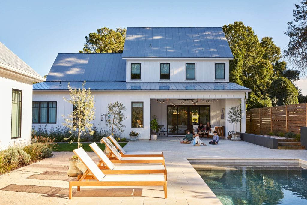 Backyard with swimming pool and lounge chairs