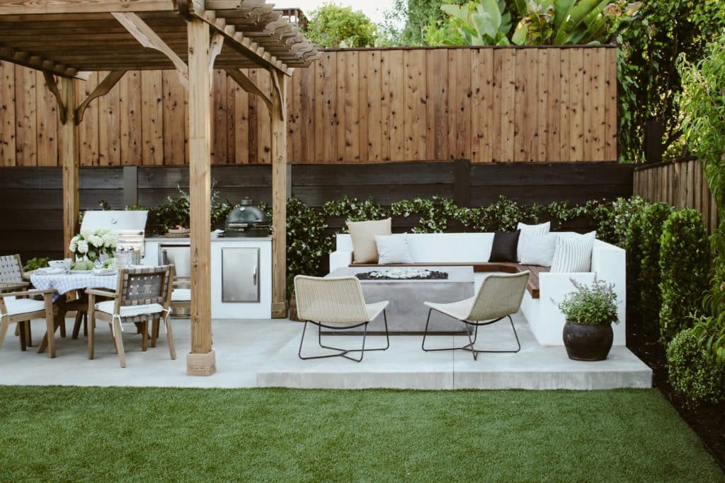 Backyard with pergola, fire pit and outdoor dining area