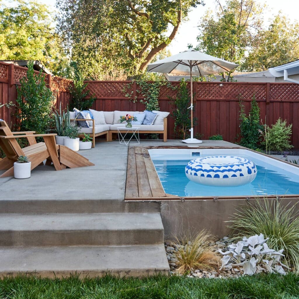 Backyard with small heated plunge pool and deck lounge area