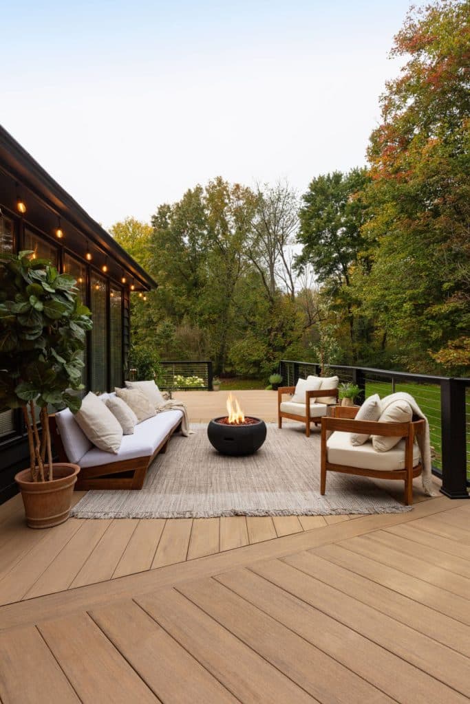 Backyard with deck and fire pit lounge area